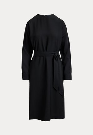 Black dress with long sleeves, round neckline, and belted waist. Smooth fabric with a solid color and subtle sheen. Knee-length cut.