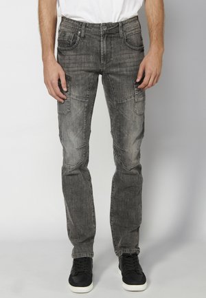 Pieguloša piegriezuma džinsi - denim black denim