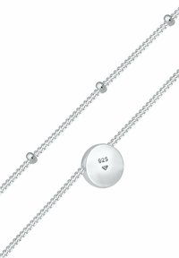 Silver bracelet featuring a woven design, round smooth clasp with "925" engraving, and small round beads along the chain.