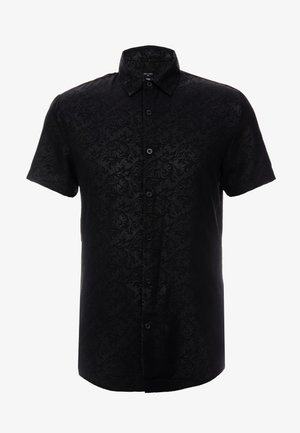 Chemise noire à manches courtes boutonnée avec motif jacquard floral subtil et col classique, taille moyenne, vue de face.