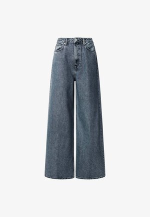 Bredde ben, højtaljede jeans i mørkeblå denim. Har klassiske forlommer, bæltestropper og en lynlåslukning med en metalknap.