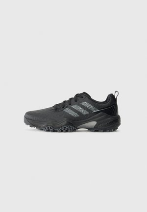 Black athletic shoe with textured sole and three reflective gray stripes on the side, designed for trail running or outdoor use.
