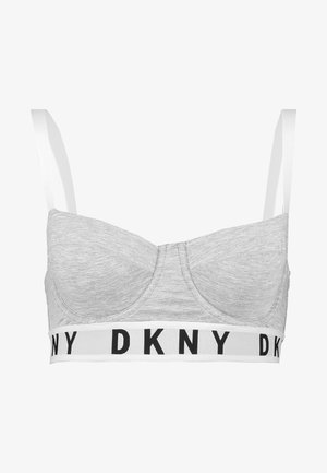 Grå trådløs bralette med kopper, bred hvit kant med svart "DKNY"-logo, og tynne justerbare stropper. Jevn tekstur overalt.