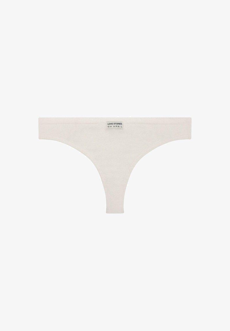 White ribbed thong made of soft fabric, featuring a wide waistband with a label that reads "LOVE STORIES OH APRIL."