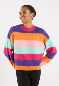 Colorful striped sweater featuring yarn in orange, pink, mint, purple, and red. Round neck, loose fit, and soft textured finish.