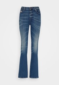 Flared jeans in dark blue denim with a faded finish. Features a high waist, five-pocket design, and metal button closure.