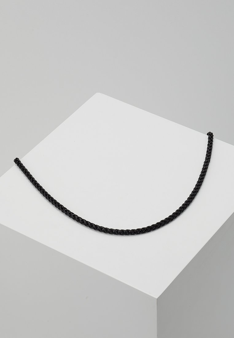 Black braided rope necklace resting on a white pedestal. Features a smooth texture and uniform width throughout its length.