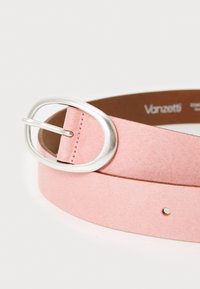 Pink suede belt with a silver oval buckle, featuring a smooth texture and several holes for adjustment. Brown inner lining visible.