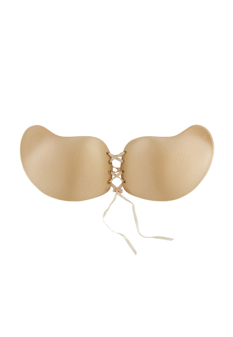 Reggiseno adesivo senza schienale di colore nude, con coppe morbide e arrotondate e centro laccato con nastri sottili. Texture morbida, design senza cuciture.