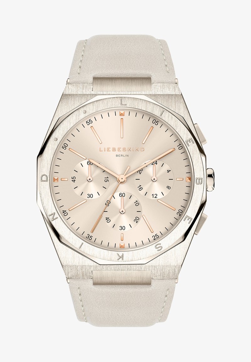 Zilverkleurig horloge met een octagonaal kast, een beige wijzerplaat en rosegouden accenten. Beschikt over drie subdials en een gestructureerde lichtbeige leren strap.