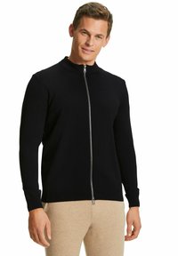 Schwarzer Zip-Up-Pullover mit hohem Kragen, aus einem glatten Strickstoff gefertigt. Verfügt über lange Ärmel und einen metallischen Reißverschluss.