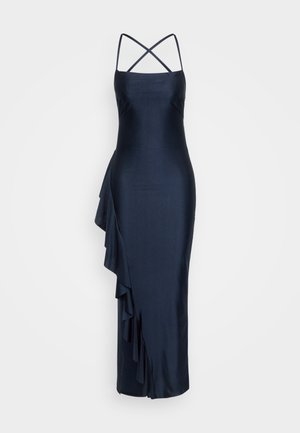 Tumesat silmusega satiinist kleit, millel on õhukesed risti minevad sangad, asümmeetriline volaan detail küljel, kehakinnitus siluett ja põlvini ulatuv lõpp.