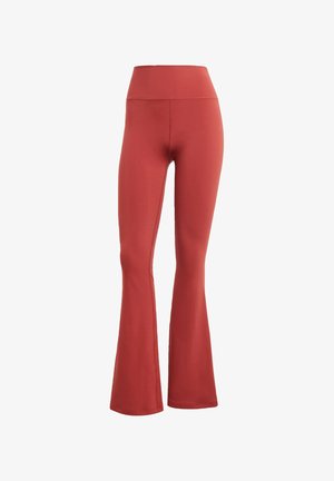 Punaiset leveälahkeet leggingsit korkealla vyötäröllä, valmistettu joustavasta kankaasta. Sileä pinta ilman näkyviä kuvioita tai metalliosia.