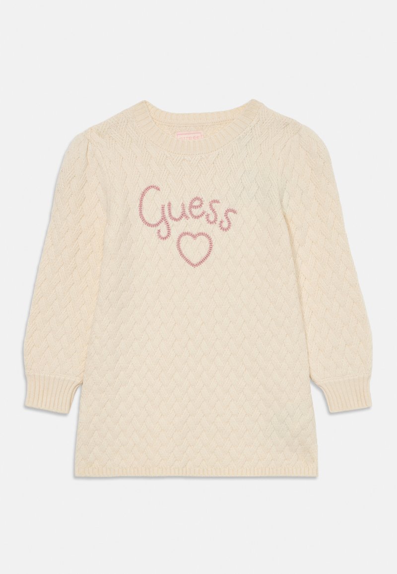 Maglione lavorato a maglia in crema con un motivo a diamante testurizzato. Presenta un collo rotondo e maniche a sbuffo. "Guess" e cuore ricamati in rosa.