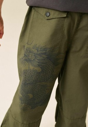 Next, REGULAR FIT - SUPERWIDE PARACHUTE TROUSERS - Trousers - khaki green