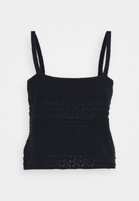 Musta neulepaita ohuilla olkaimilla, jossa on teksturoitu pinta ja monimutkaiset kuviot. Hiukan vartalonmyötäinen siluetti, joka korostaa vaakasuoria yksityiskohtia.