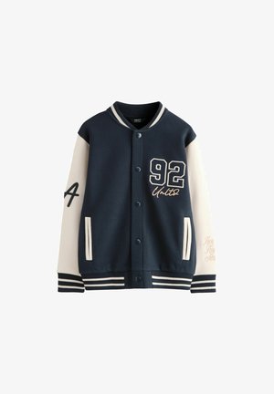 Navy blue and white varsity jacket with snap buttons, striped cuffs, number 92 on chest, letter A on left sleeve, and front pockets.