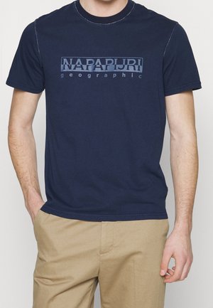 Marineblå bomulds-T-shirt med frontlogo i lysere nuancer. Korte ærmer, rund hals og lige kant.
