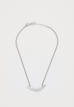 Silver pendant necklace with a delicate chain. Features an intricate design resembling foliage and small gem accents.