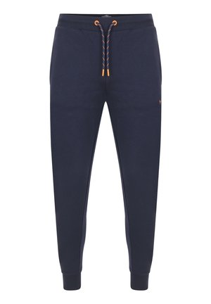 Navyblaue Sweatpants aus Baumwolle mit einem elastischen Bund und orangen Kordeln, gerippten Bündchen und einem kleinen Logo an der Seite.