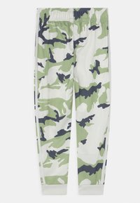 Kárované kalhoty v zelené, bílé a námořnické barvě. Vyrobené z lehké tkaniny s elastickým pasem a zúženými manžetami u kotníků.