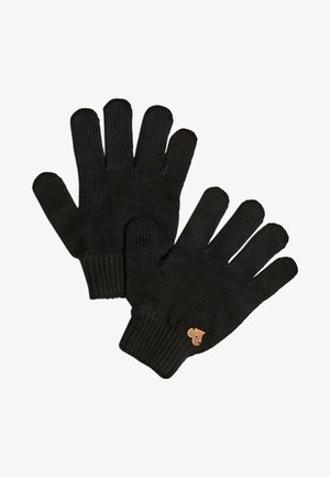 Guanti neri lavorati a maglia con una finitura texturizzata, dotati di un piccolo accento a forma di cuore di colore contrastante nell'area del polso.