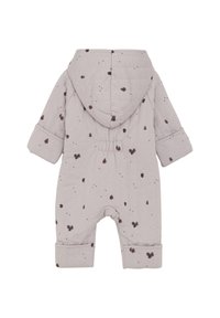 Quilted, lys grå buksedragt med hætte, prydet med små, mørkebrune bladmønstre og manchetter ved ærmerne. Bagfra ses elastik i taljen.