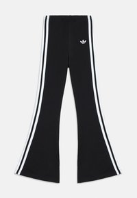 Juodos medvilninės platėjančios kelnės su baltomis šoninėmis juostomis. Kairėje pusėje yra mažas baltas logotipas. Elastinė juosmens juosta užtikrina patogumą.