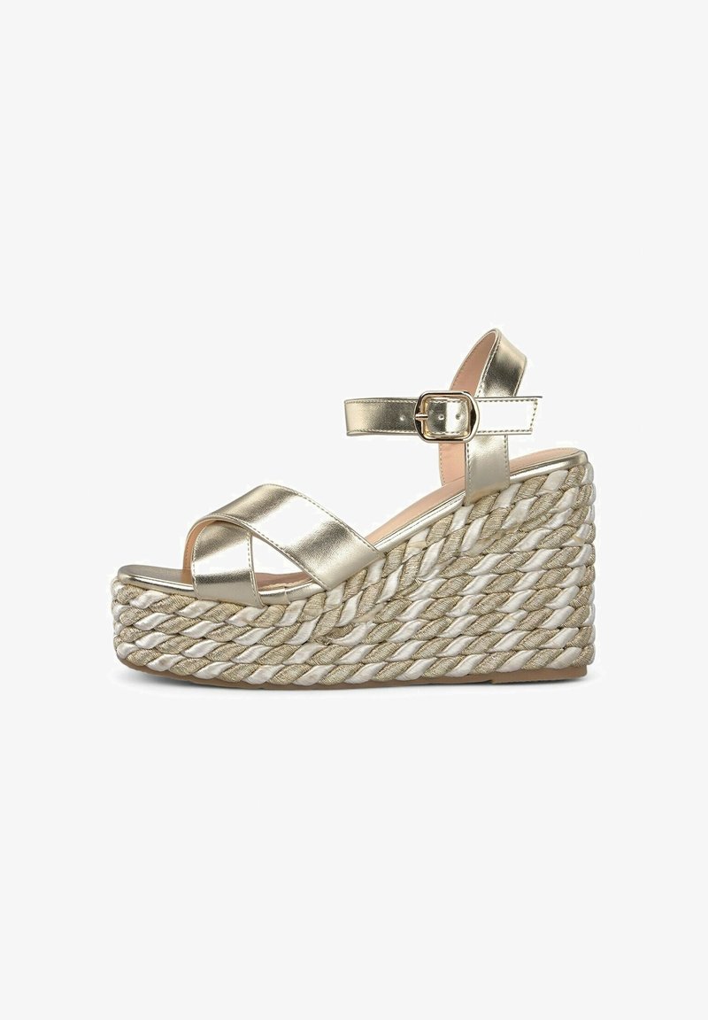 Metallic gold wedge sandals with crossed straps and ankle buckle. Woven jute-style platform with a textured finish.
