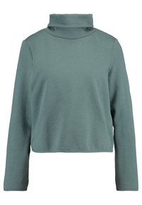 Långärmad kort turtleneck i dämpad teal med avslappnad passform och enkel, sömlös design.
