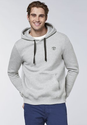 Gray hoodie with a kangaroo pocket, dark drawstrings, and an embroidered logo on the left chest. Soft texture and casual fit.