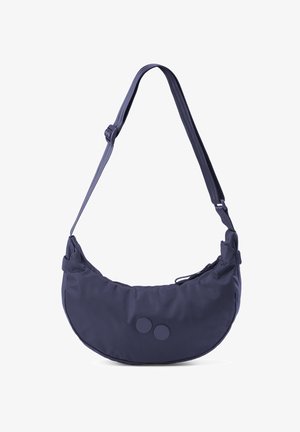 Donkerblauwe schoudertas in de vorm van een halve maan met verstelbare riem en twee ronde decoratieve knopen aan de voorkant.