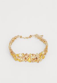 Gold-tone choker necklace featuring clusters of yellow and amber-colored gemstones in various shapes and sizes with a lobster clasp closure.