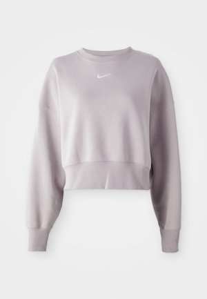 Kurz geschnittenes, helllila Sweatshirt mit langen Ärmeln, gerippten Bündchen und kleinem weißen Nike-Logo auf der Brust. Weiche Stoffstruktur.
