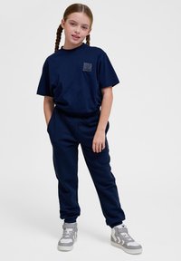 Hummel CLEAN ADJUSTABLE - Trainingsbroek - black iris