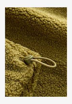 Textured olive-green fleece with a soft, nubby surface. Includes a toggled drawstring for adjustment and securing.
