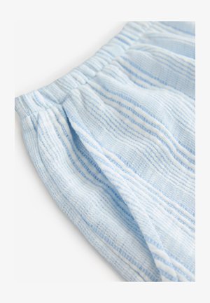 Tessuto azzurro chiaro strutturato con strisce orizzontali bianche. Presenta una vita elasticizzata arricciata. Materiale morbido e tessuto con un aspetto casual.