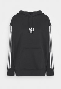 Black hoodie with a kangaroo pocket, white three-stripe detailing on sleeves, and a small white logo on the chest. Soft fabric, relaxed fit.