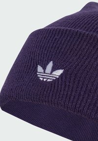 Purple knitted beanie featuring a ribbed texture and a white embroidered logo of three stripes and leaves on the front.