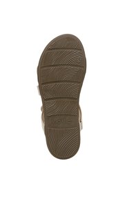 Vionic sandaal zool, getextureerd rubber in bruin, met een golvend loopvlakpatroon voor grip en branding op de onderzijde.