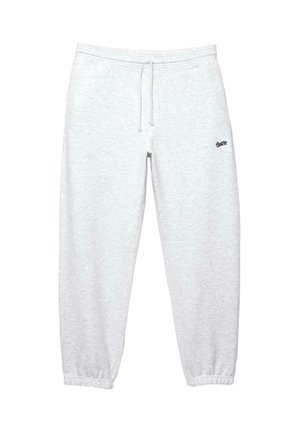 Pantalons de survêtement légers gris avec une taille élastique et un cordon de serrage. Resserrés au niveau de la cheville. Petit logo noir sur la cuisse gauche.