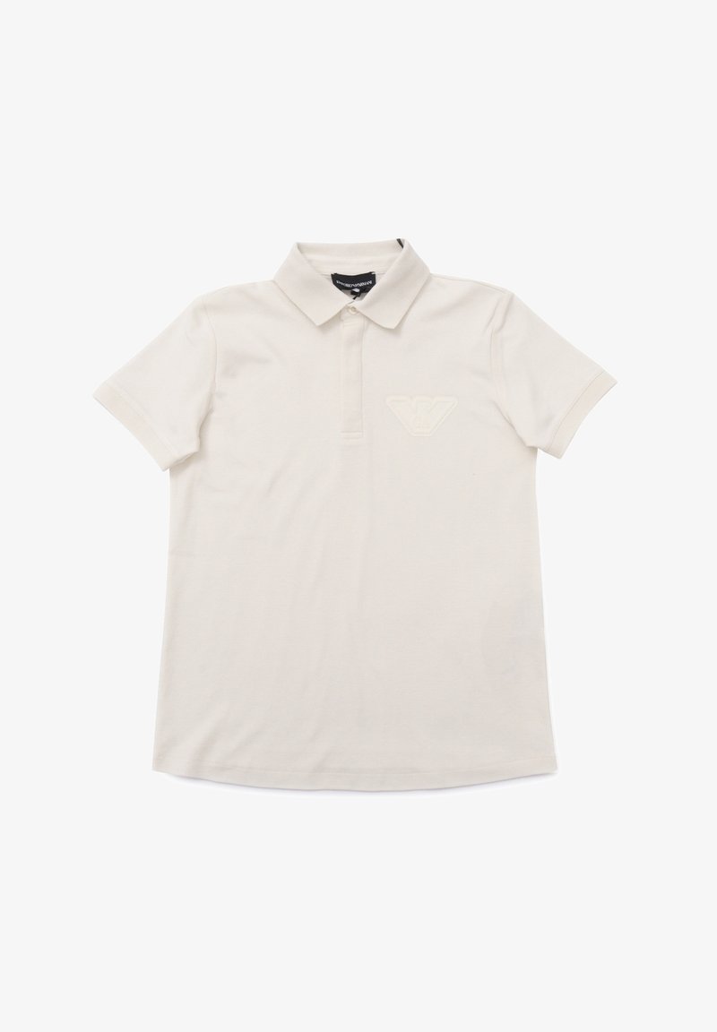 Polo shirt beige chiaro in cotone, con colletto classico, maniche corte e logo stampato sul lato sinistro del petto.
