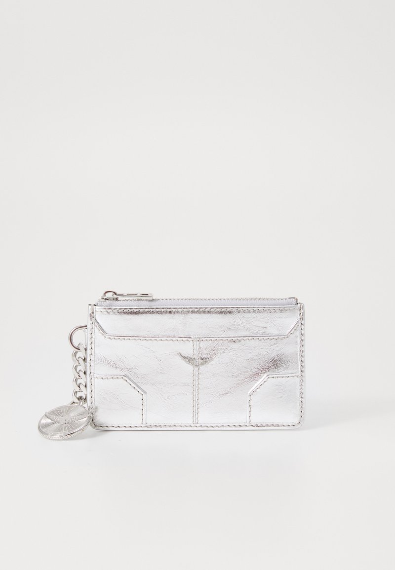 Silver metallic wallet with a textured finish, zip closure, chain attachment, and embossed detailing on the front. Compact rectangular shape.