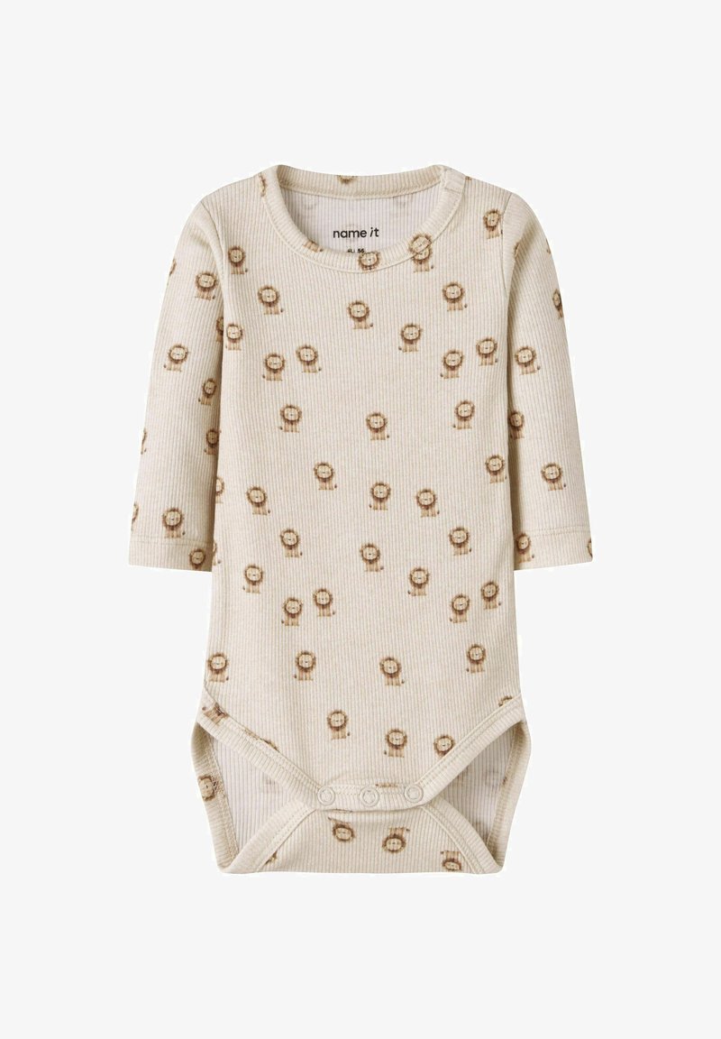 Body bébé crème à manches longues côtelé avec de petits motifs de visage de lion marron et des pressions à l’entrejambe.