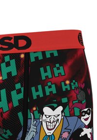 Boxer shorts featuring a red elastic waistband, black and colorful graphic print with cartoon characters, text, and comic-style elements.