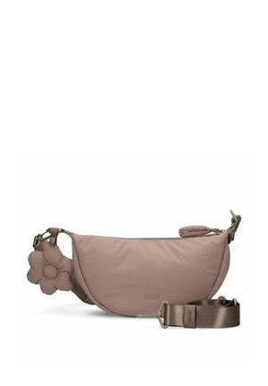 Taupe half-moon crossbody bag with zipper, adjustable strap, and a soft flower-shaped keychain attached on the side.