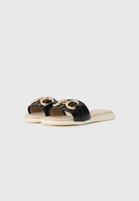 Black satin slide sandals featuring a wide strap with gathered detailing and gold-tone circular hardware on the front. Soft beige footbed.