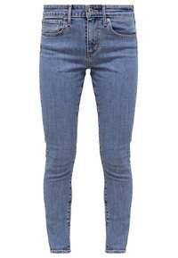 Helleblaue Skinny-Jeans aus Denim, mit fünf Taschen, einem Reißverschluss und Knopfverschluss sowie dezenten Ausbleichungen an den Beinen.