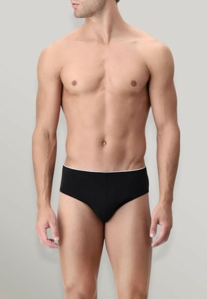 Boxer da uomo neri realizzati in un tessuto morbido, con un elastico bianco in vita. Il design è minimalista e aderente.