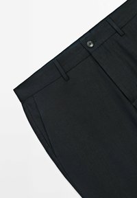 Dark tailored trousers with a smooth texture, featuring side pockets and a button closure at the waistband. The fabric has a subtle sheen.